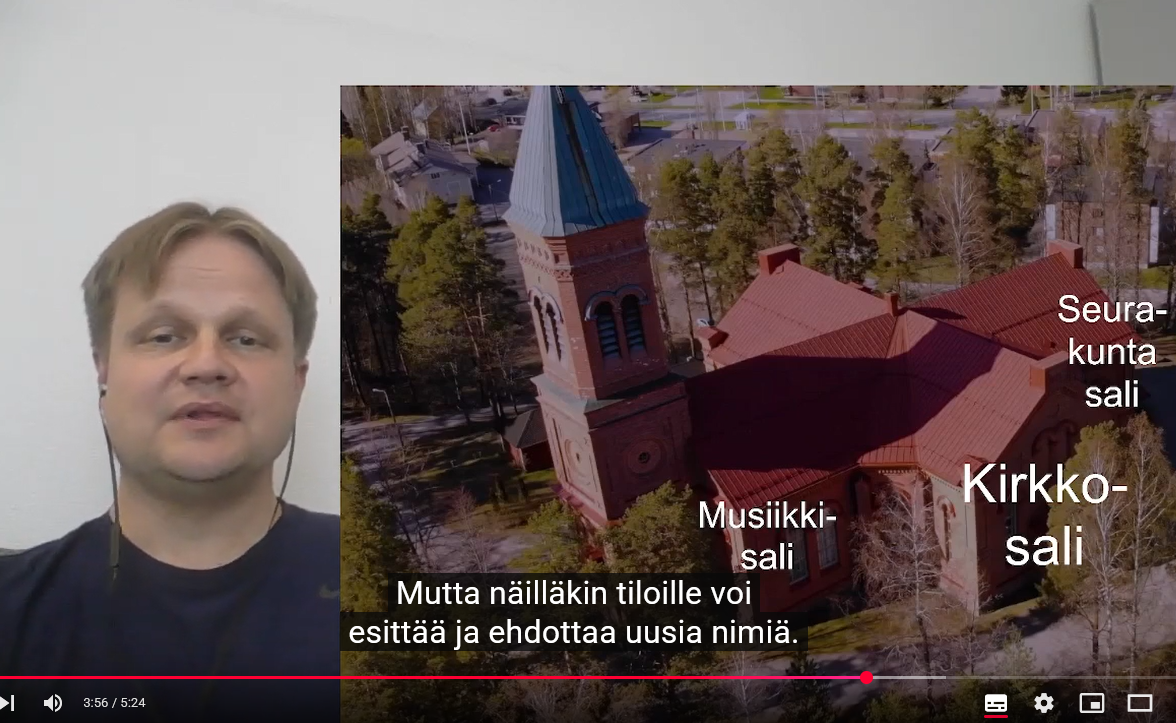 Kuvakaappaus videolta, jossa esitellään toimitiloja, kuvassa kirkkoherra Tuomas Hynynen ja Lopen kirkon salit